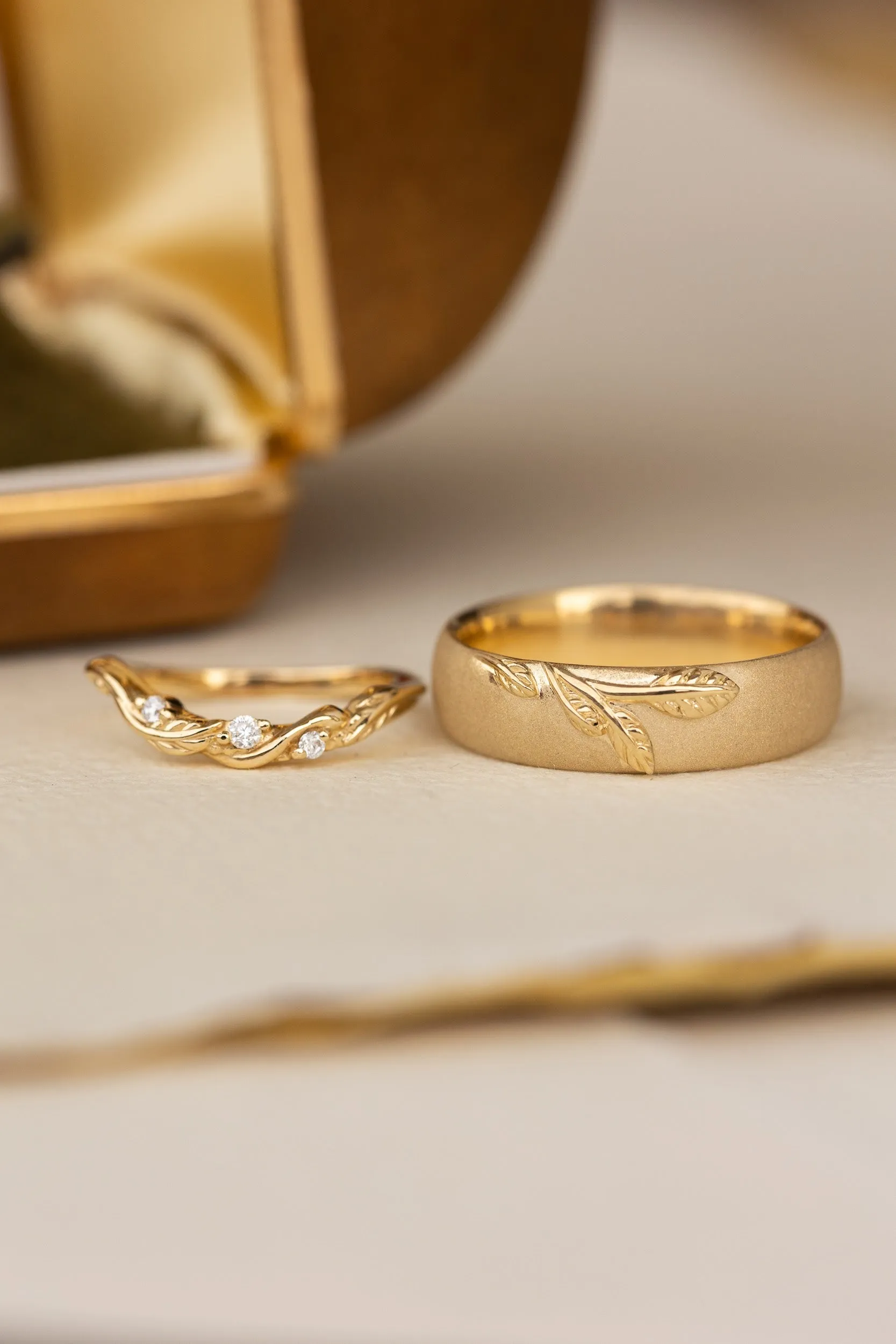 Wedding rings set for couples: satin band with branch for him, curved leaf ring with gemstones for her